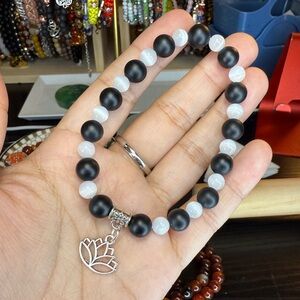 Elegant Black and White Beaded Bracelet with Lotus Charm